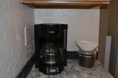 a coffee maker sitting on top of a counter at In The Oaks in Three Rivers