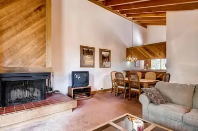 a living room with a couch and a fireplace at Less Than 1 Mile to Northstar Resort Getaway with Balconies in Truckee
