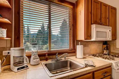a kitchen counter with a sink and a window at Less Than 1 Mile to Northstar Resort Getaway with Balconies in Truckee