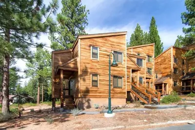 a wooden house with a staircase in front of it at Less Than 1 Mile to Northstar Resort Getaway with Balconies in Truckee