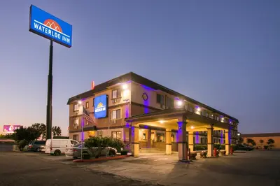 a hotel with a sign in front of a building at Waterloo Inn in Stockton