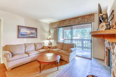a living room with a couch and a fireplace at Incline Oasis in Incline Village