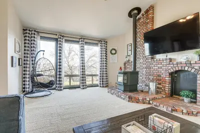 a living room with a fireplace and a tv at Pet-Friendly Jackson Wine Country Home with Pool! in Jackson