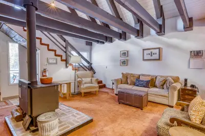a living room with a fireplace and a couch at Eska's Escape in Soda Springs