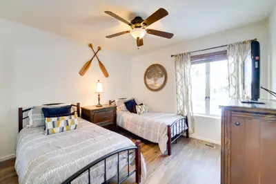 a bedroom with two beds and a ceiling fan at Snowcreek Resort Condo with Deck at Mammoth Mountain in Mammoth Lakes