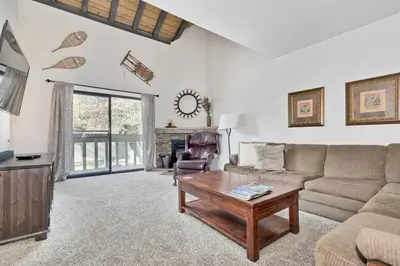 a living room with a couch and a coffee table at La Vista Blanc 78 in Mammoth Lakes