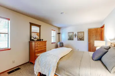 a bedroom with a large bed and a dresser at Summer Creek in Groveland