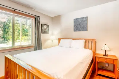a bedroom with a bed and a window at Sugar House in Soda Springs