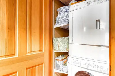 a kitchen with a refrigerator and a washer and dryer at Sugar House in Soda Springs
