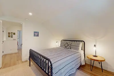 a bedroom with a large bed and a table at Bearing Drive Escape in Tahoe City