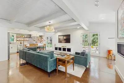 a living room with two couches and a table at Bearing Drive Escape in Tahoe City