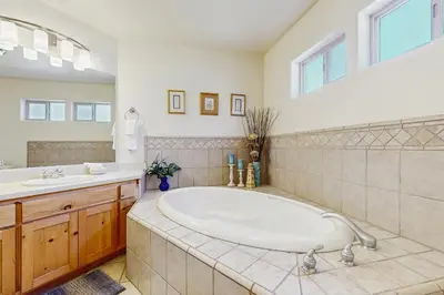 a large bathroom with a tub and a sink at Boat House in Soda Springs