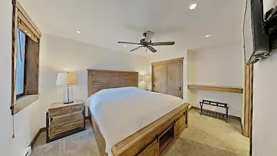 a bedroom with a bed and a ceiling fan at 1849 Condos 562 home in Mammoth Lakes