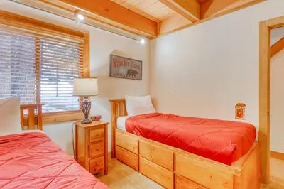 a bedroom with two beds and a window at Northstar Perch in Truckee