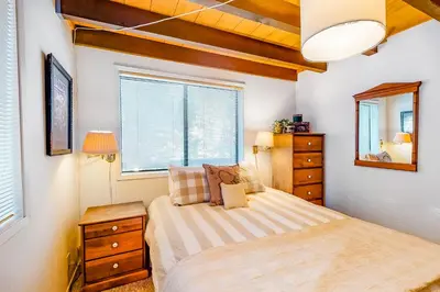 a bedroom with a bed and a window at Hillside Haven in Soda Springs