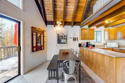 a kitchen with a table and chairs and a counter at Hillside Haven in Soda Springs
