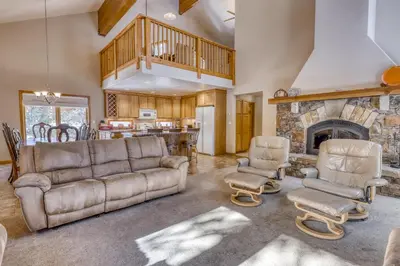 a living room with a couch and a fireplace at Four Seasons Lakeside in Soda Springs