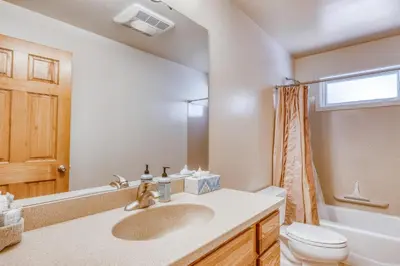 a bathroom with a sink and a toilet at Four Seasons Lakeside in Soda Springs