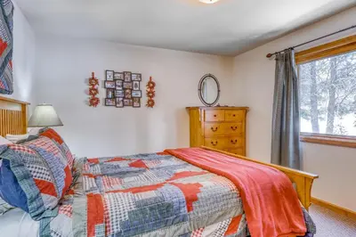 a bedroom with a bed and a window at Four Seasons Lakeside in Soda Springs