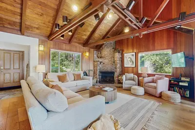 a living room with couches and a fireplace at Beaver Cove Lodge in Truckee