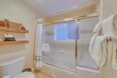 a bathroom with a shower and a toilet at Central Townhome Less Than 1 Mi to The Village at Mammoth! in Mammoth Lakes