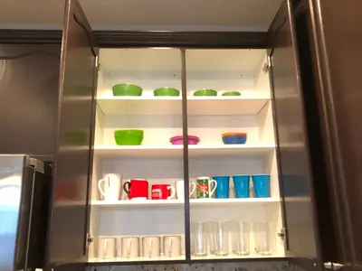 a refrigerator filled with lots of colorful bowls and cups at Modern Luxury Living, relax and enjoy your stay! in Rancho Cordova