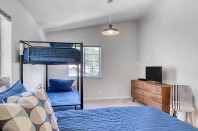 a bedroom with a bunk bed and a tv at Captains Quarters Retreat in Zephyr Cove