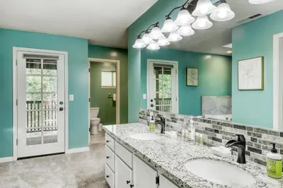 a bathroom with two sinks and a mirror at Captains Quarters Retreat in Zephyr Cove