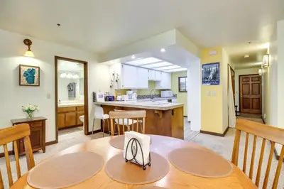 a dining room and kitchen with a table and chairs at Walk to Ski Shuttle Incline Village Condo in Incline Village