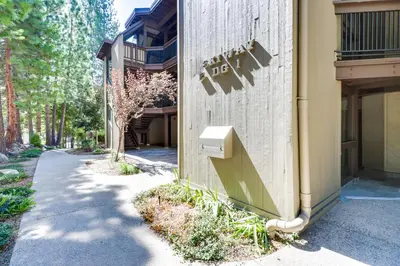 a building with a sign on the side of it at Walk to Ski Shuttle Incline Village Condo in Incline Village