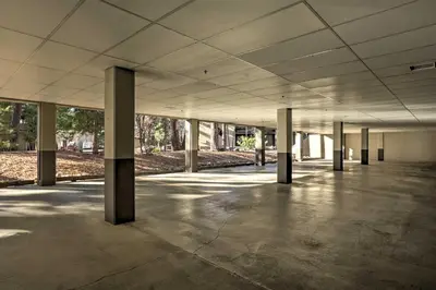 an empty parking lot with columns in an empty building at Walk to Ski Shuttle Incline Village Condo in Incline Village