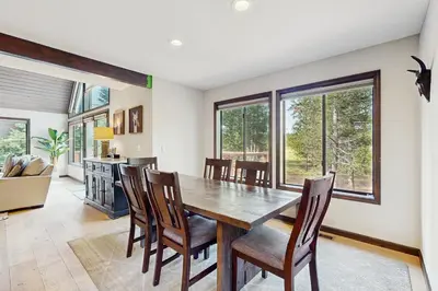 a dining room with a wooden table and chairs at Meadowview in Truckee