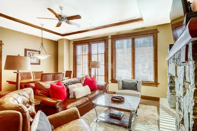 a living room with a couch and a table at Northstar Village #410 in Kingswood Estates