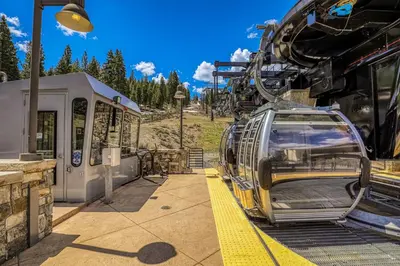 a ski lift with a car parked next to a train at Northstar Village #410 in Kingswood Estates