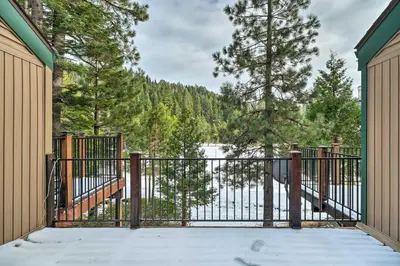a gate to a house with a view of a lake at Pinecrest Retreat with Fireplace! in Pinecrest