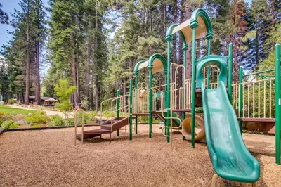 a playground with a slide in a park at Aspen Grove Getaway in Kingswood Estates