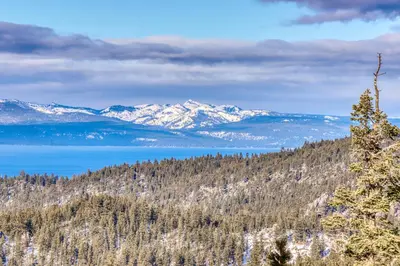 a mountain view of a lake and snow covered mountains at Heavenly Hideaway in Stateline