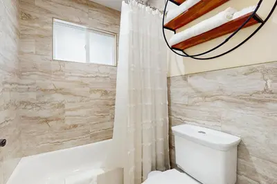 a bathroom with a white toilet and a shower at Heavenly Hideaway in Stateline