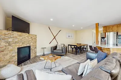 a living room with a couch and a fireplace at Heavenly Hideaway in Stateline