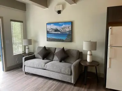 a living room with a couch in a room at Tahoe Trail Resort in Stateline