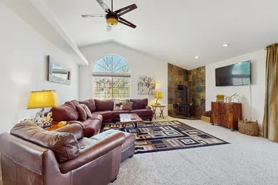 a living room with a brown leather couch at Life on Mt Olympia in South Lake Tahoe
