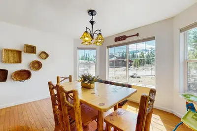a dining room with a wooden table and chairs at Life on Mt Olympia in South Lake Tahoe