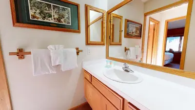 a bathroom with a sink and a mirror at Snowcreek III #448 condo in Mammoth Lakes