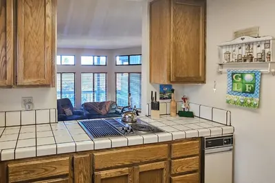 a kitchen with a counter top and a stove top oven at Tee Time Terrace in Groveland