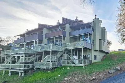 a large building with decks on a hill at Tee Time Terrace in Groveland