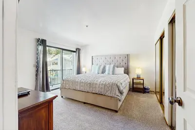 a bedroom with a bed and a desk and a window at South Star Pines Retreat in Stateline