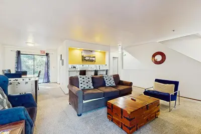 a living room with a couch and a table at South Star Pines Retreat in Stateline
