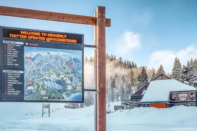 a sign in the snow next to a ski lodge at South Star Pines Retreat in Stateline