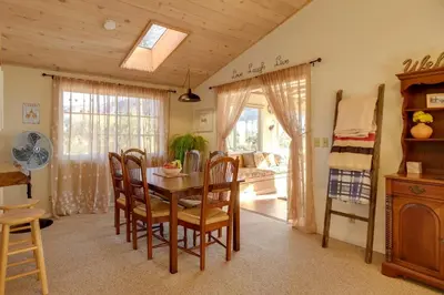 a dining room with a table and chairs and a bedroom at Secluded Mountain Hideaway Less Than 8 Miles to Bass Lake! in North Fork