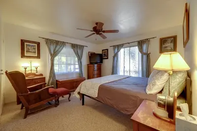 a bedroom with a bed and a desk and a chair at Secluded Mountain Hideaway Less Than 8 Miles to Bass Lake! in North Fork